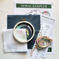 Spiral Sampler whimsical floral beginner embroidery kit by Jessica Long on Navy Fabric