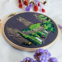 The Circus Lane hoop laid flat on white with dried purple and yellow flowers around it